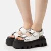 Buffalo Flora On - Platform Sandals - White 1 Buffalo Flora On - Platform Sandals - White -Fashion Shoe Store 3f9998392db347508b661b1f6037d9c3