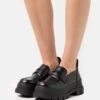 Buffalo Vegan Aspha Loafer - Slip-Ons - Black -Fashion Shoe Store 98614713e8c349908bd21760a78e0175